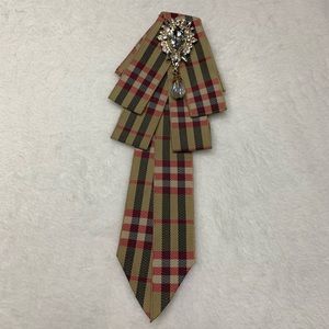 Brown with red brooch